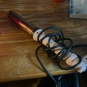 Lange Curling iron in. Pink gently used